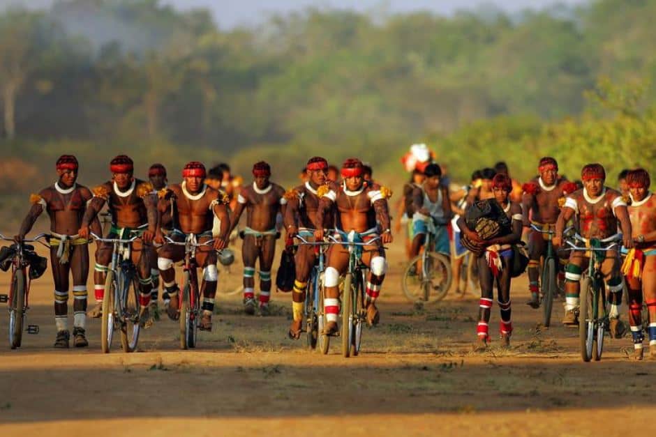 Brazilian Awati indians biking in the Amazon rainforest