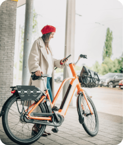 Antwerp looking at phone orange bike